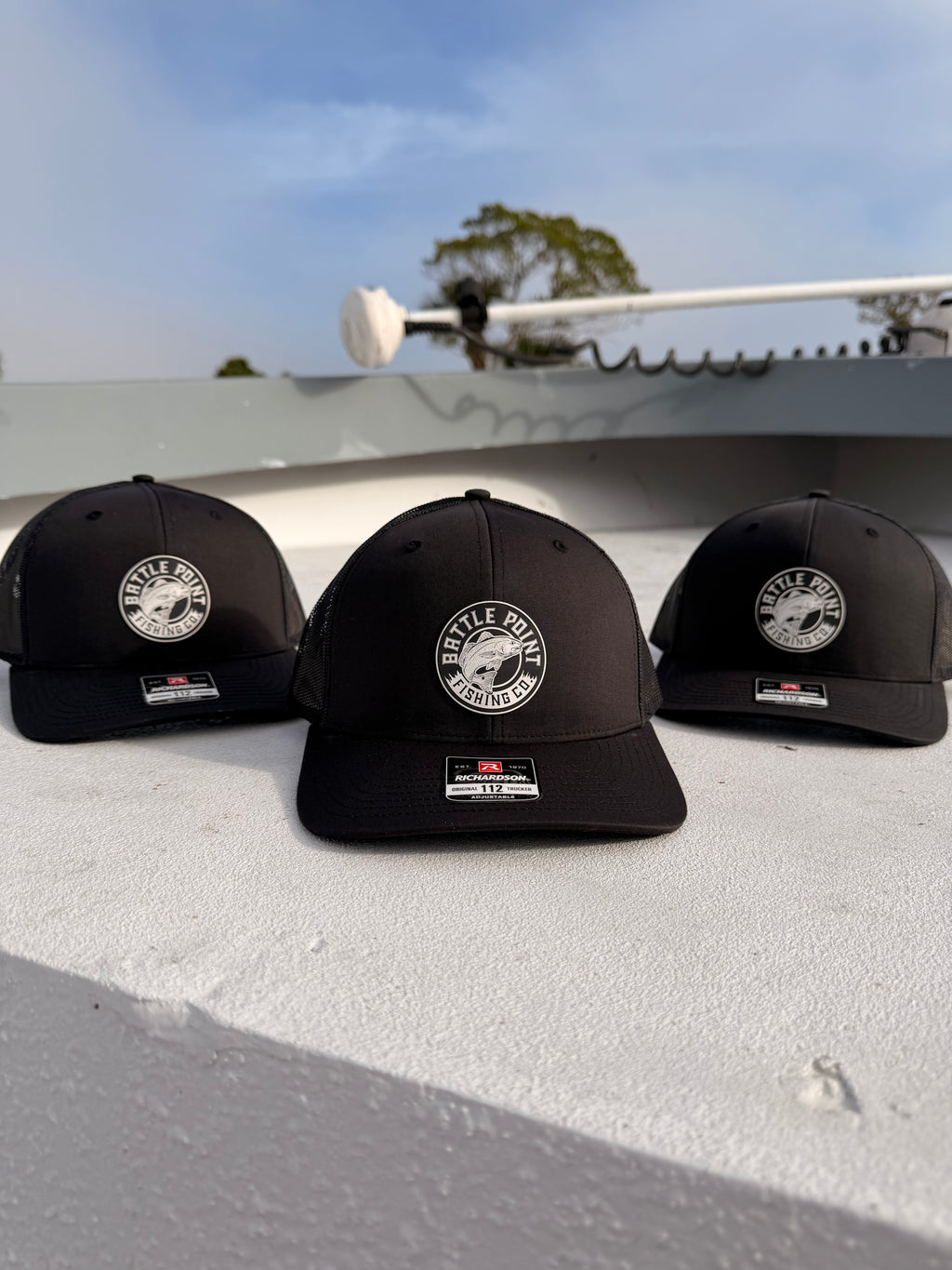 Black fishing hat with redfish logo side view